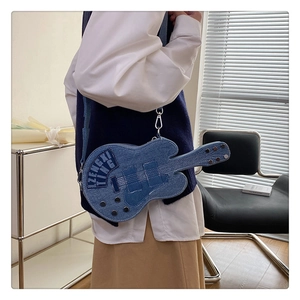 Detailed denim guitar-shaped shoulder bag featuring silver rivets and letter prints
