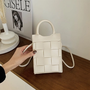 Off-white woven faux leather handbag with top handle and crossbody strap for women