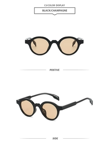 Detail view of retro oval sunglasses with thick black frames and champagne lenses