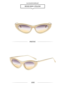 Dettaglio occhiali da sole cat eye con montura beige e lenti viola sfumate