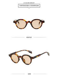 Detailed view of tortoiseshell oval sunglasses with champagne lenses in model C7