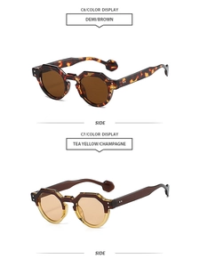 Detail view of tortoiseshell and champagne irregular sunglasses frames with rivet accents