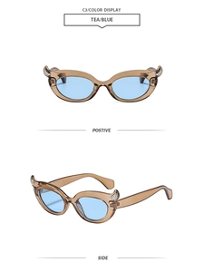 Detailed front and side views of trendy cat-eye sunglasses with tea frames and blue lenses