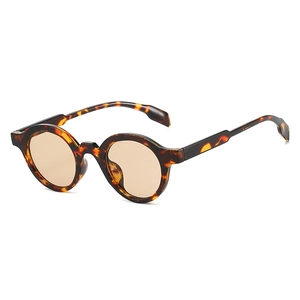 Retro oval tortoiseshell sunglasses with amber frames and brown tinted lenses for women