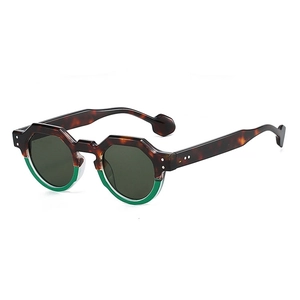 Classic irregular tortoise and green sunglasses with dark grey lenses in 45-degree view