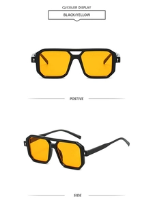 Detail view of vintage square sunglasses with black frame, yellow lenses, and double bridge