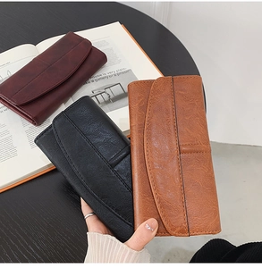 Τρία vintage μακριά πορτοφόλια από συνθετικό δέρμα σε καφέ, μαύρο και μπορντό χρώμα