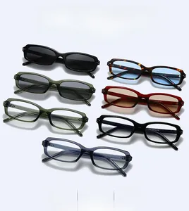 Flat lay of classic square sunglasses in multiple colors with detailed model engraving