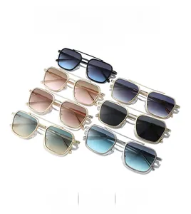 Flat lay of double bridge square metal sunglasses in seven assorted gradient lens colors