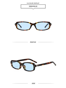 Detail view of tortoiseshell square sunglasses with blue lenses and metal hinge rivets
