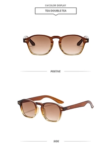 Détail de lunettes de soleil carrées rétro marron avec rivets dorés et verres dégradés