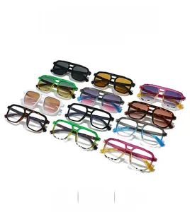 Flat lay of retro double-bridge pilot sunglasses in eleven diverse trendy color options