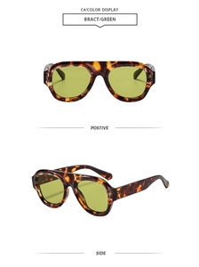 Detail view of tortoiseshell aviator sunglasses with green lenses from front and side