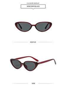 Close-up of wine red cat eye sunglasses featuring silver rivet details and black lenses