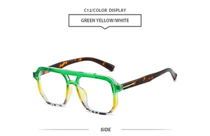 Side view of retro aviator sunglasses with green-yellow gradient frame and tortoiseshell temples