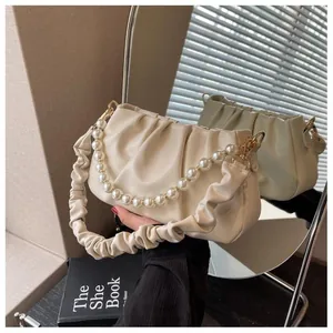 Detailed view of off-white ruched cloud bag featuring elegant pearl bead chain and soft pleats