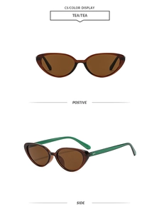 Detail view of cat-eye sunglasses with tea brown frame and contrasting green temples
