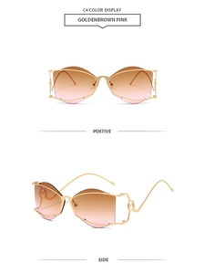 Detail of rimless gold metal wave sunglasses with M-letter hinge and gradient brown lenses