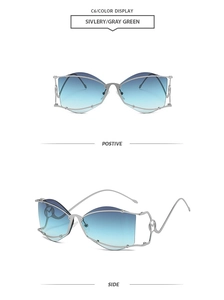 Detail view of silver wireframe sunglasses with blue-green gradient lenses and M-logo hinge