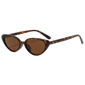 Vintage tortoiseshell cat-eye sunglasses with dark brown lenses and metal rivet details