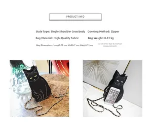 Detail view of cat shaped crossbody bag with green eyes and golden chain strap