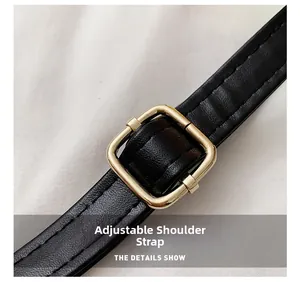 Detail showing the adjustable black leather strap with premium gold metal buckle
