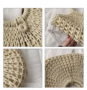 Detail of hollow-out hand-woven straw tote bag with round buckle and texture