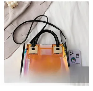 Detail showing colorful laser PVC tote bag with black handles and metal hardware
