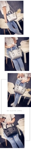 Detailed view of cat ear handbags in black and silver with gold metal whiskers