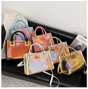 Detailed display of colorful laser PVC tote bags on leather sofa with elegant styling