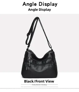 Front view detail of a black multi-zipper crossbody bag made of soft faux leather