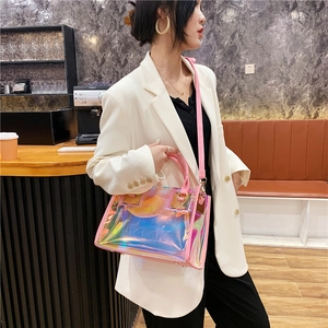 Chic laser iridescent transparent PVC handbag with pink trim and gold metallic hardware