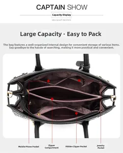 Detailed interior view of a black crocodile pattern handbag showing multi-pocket layout