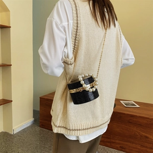 Elegant black pearl handle mini box bag with shimmering sequins and gold chain strap