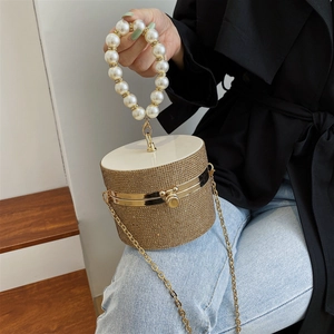 Elegant cylindrical evening bag with diamond rhinestones and pearl handle strap