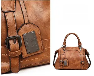 Close-up of vintage brown Boston bag with wrinkled faux leather and metal buckle detail