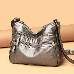 Metallic silver leather crossbody bag with multiple zipper pockets for women