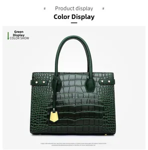 Detail of dark green crocodile pattern handbag with gold hardware and rivets