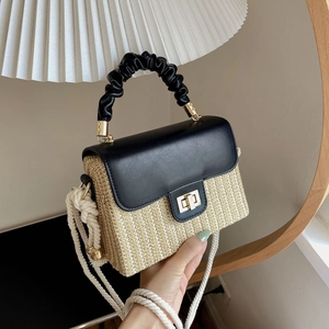 Minimalist straw woven crossbody bag with black leather flap and thick rope strap