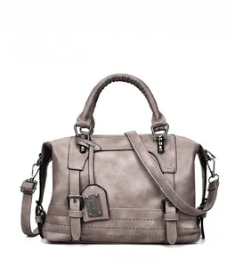 Detail of grey retro Boston bag featuring metal buckle and adjustable shoulder strap