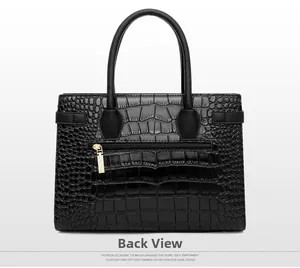Back view of black crocodile pattern handbag showing rear zipper and gold hardware