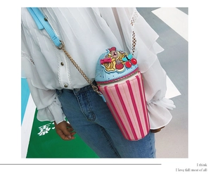 Creative ice cream shaped crossbody bag with stripes and cherry detail on model