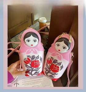 Pink Russian doll mini PU leather crossbody bag with floral pattern and gold zipper