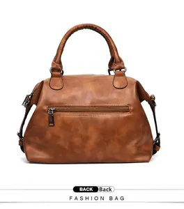 Brown Boston handbag back view featuring a functional horizontal zipper pocket