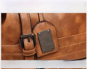 Macro shot of brown pebble grain sheepskin leather with metallic gunmetal buckles and plate