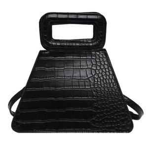 Elegant black crocodile pattern trapezoid handbag with hollow handle for women