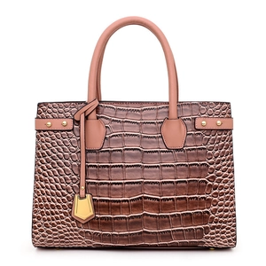 Brown crocodile embossed handbag with pink handles and elegant gold metal accents