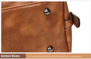 Close-up of durable protective metal studs on the bottom of a vintage brown leather bag
