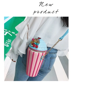 Detail of ice cream cup crossbody bag with pink stripes and blue chain strap