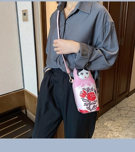 Pink Matryoshka doll shaped crossbody bag made of PU leather with rose patterns